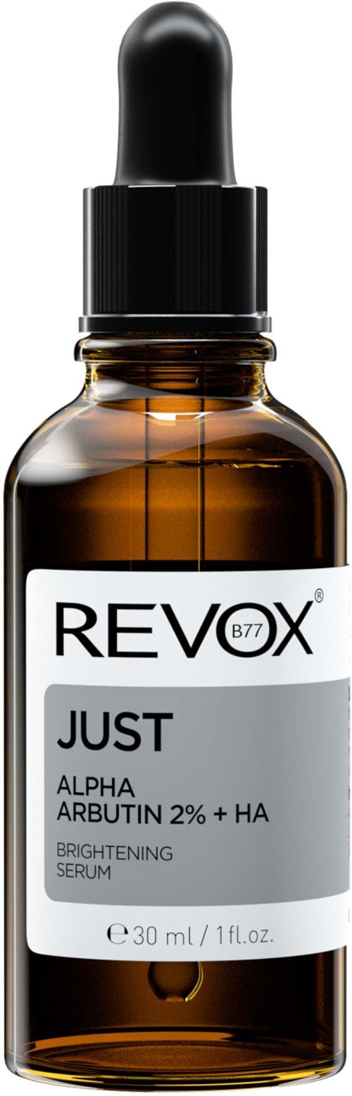 Mała brązowa butelka z kroplomierzem, opisano jako 'REVX JUST Brightening Serum' z składnikami alpha arbutin i kwasem hialuronowym.