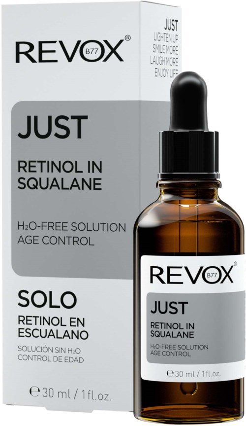 Eine braune Glasflasche mit schwarzem Tropfer, beschriftet 'Revox Just Retinol in Squalane' und Verpackung.