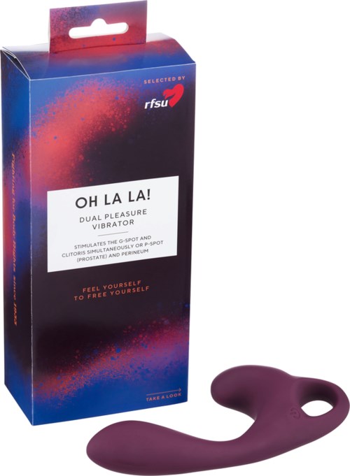 A purple dual pleasure vibrator with a curved shape, shown outside blue and red packaging with text about its features.