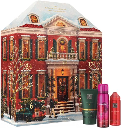 A festive advent calendar house with numbered doors, surrounded by snow and decorated for Christmas.