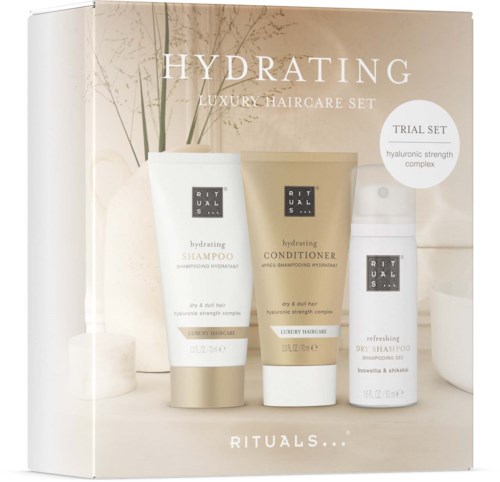 Set van drie haarverzorgingsproducten met shampoo, conditioner en droogshampoo met hydraterend thema.