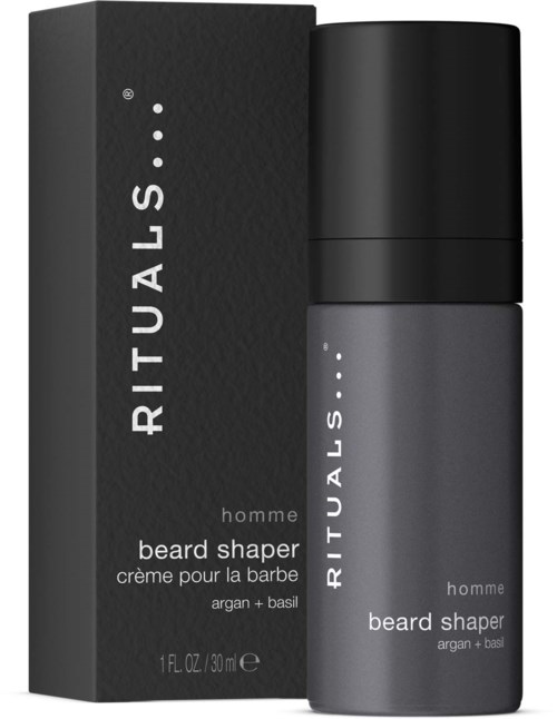 Een kleine grijze fles en een zwarte doos ernaast. De doos zegt 'RITUALS beard shaper' voor mannen met argan en basilicum.