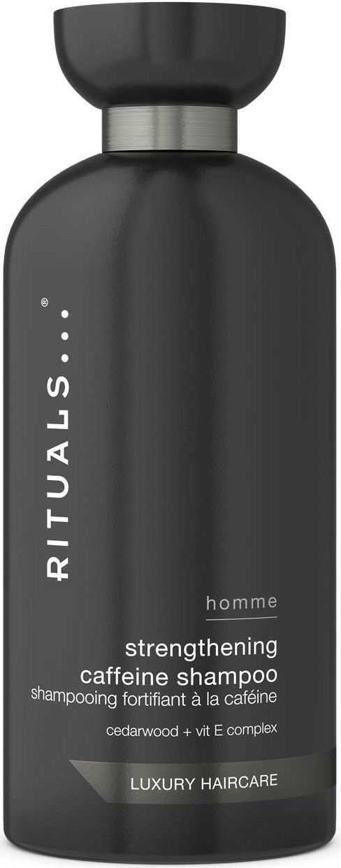 A dark gray shampoo bottle with a black cap, labeled RITUALS homme caffeine strengthening shampoo.