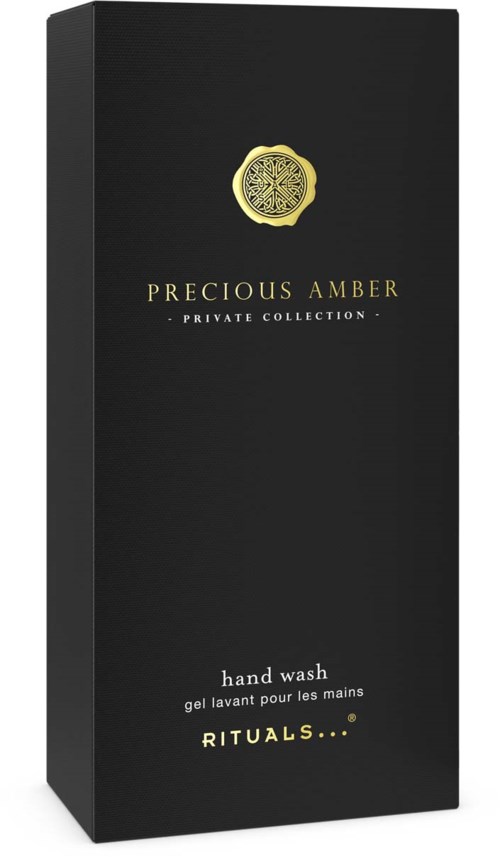 Czarna opakowanie z złotym emblematem i tekstem Precous Amber mydło do rąk od Rituals.