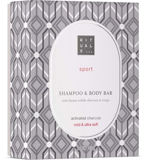 En sæbeboks med geometrisk gråt mønster, mærket siger 'Rituals sport shampoo & body bar, mild & ultra soft, aktiveret kul.'