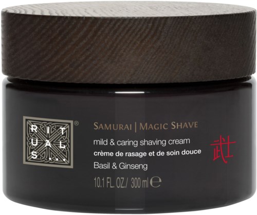 En svart burk av razul salt med en guld- och röd etikett, märkt 'Samurai Magic Shave' med basilika och ginseng.