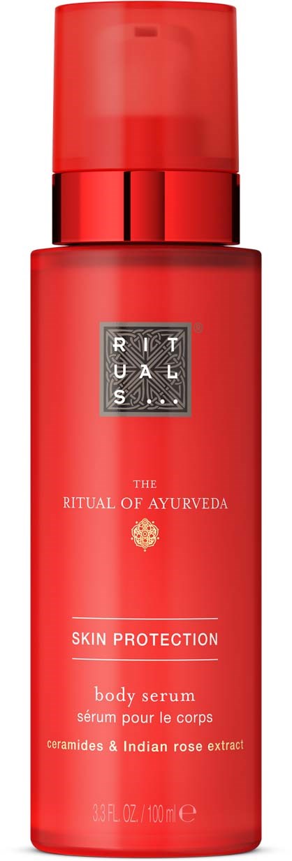 A red bottle of The Ritual of Ayurveda skin protection body serum with herbal ingredients.