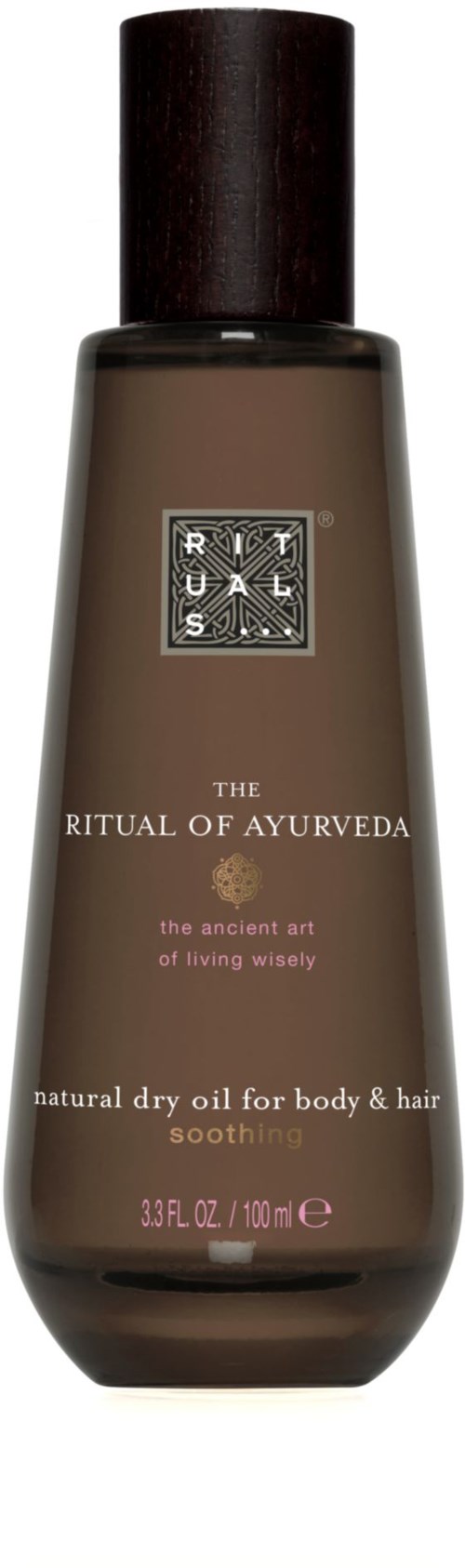 En brun flaska med svart lock märkt 'The Ritual of Ayurveda' som innehåller torrolja för kropp och hår.