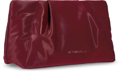 A red satin makeup bag with the brand name RITUALS printed on it.