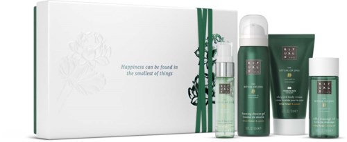 A set of four green and white skincare products with a white box and ribbon, and a quote about happiness.