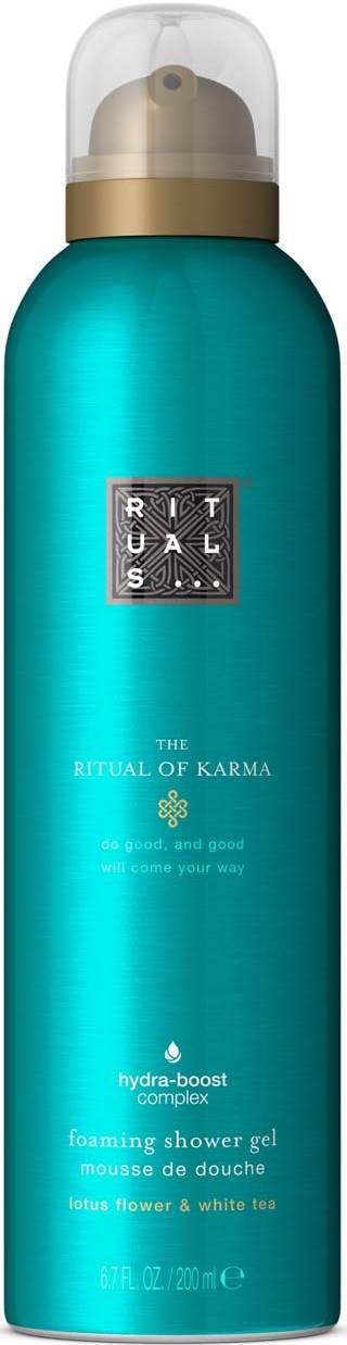 Een blauwe fles Ritual of Karma schuimende douchegel met doorzichtig deksel en gouden band.