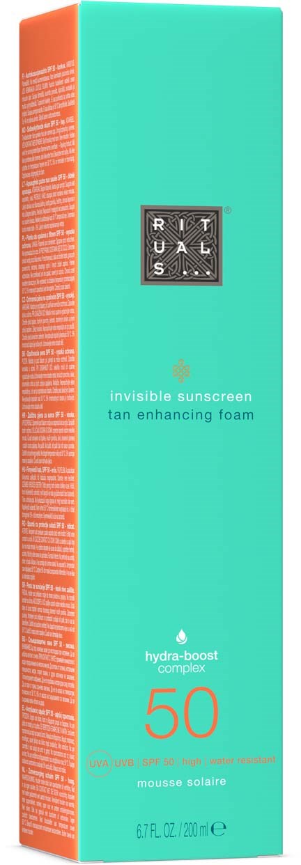 Een turquoise en oranje doos voor zonnebrandcrème genaamd RITUALS met SPF 50, gemarkeerd als onzichtbare zonnebrand en bruining bevorderende schuim.