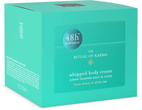 A turquoise box with white and green text, describing a whipped body cream for 48 hours hydration, scented with lotus flower and white tea.