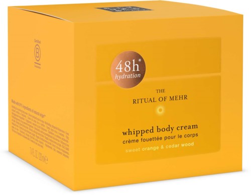 A yellow box with the label: 48-hour hydration, whipped body cream, sweet orange & cedar wood.