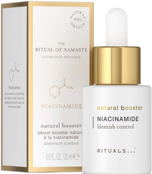 En liten hvit flaske med pipette, gullkant og tekst om niacinamide for kviskekontroll. Eske med lignende tekst.