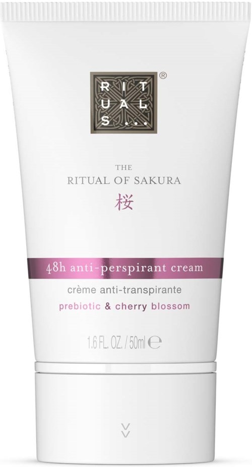 A white tube of deodorant cream with purple label, black and white logo, and pink cherry blossom symbol.