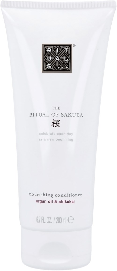 En hvit tube merket Ritual of Sakura nærende balsam med arganolje og shikakai, 200 ml.
