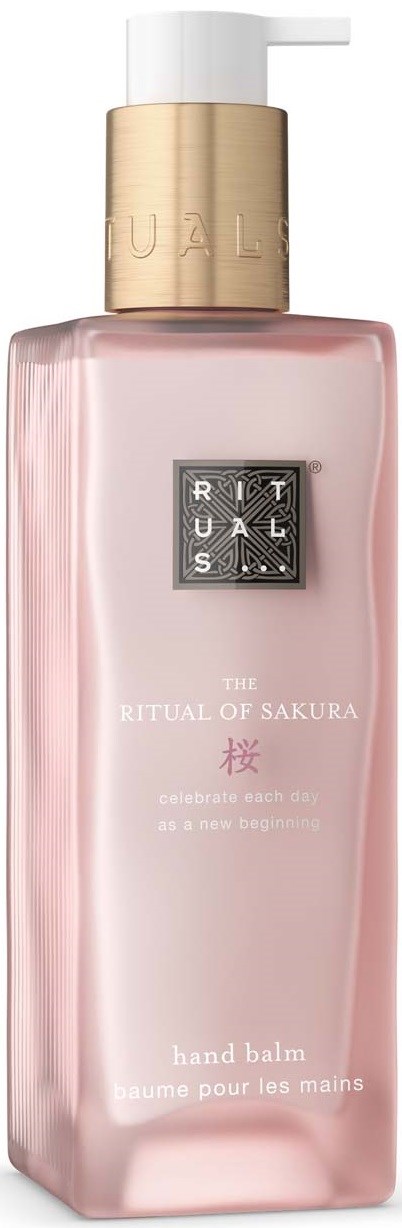 A pink hand balm in a tall, rectangular bottle with a white pump and gold cap, labeled The Ritual of Sakura.