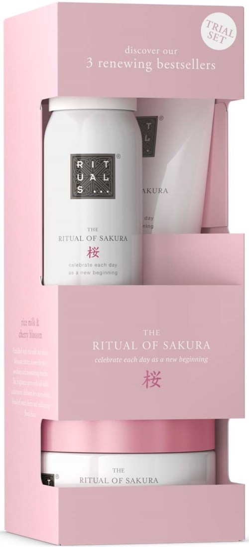 Een huidverzorgingsset met crème en lotion in roze en witte verpakking, viert een nieuw begin. Label zegt 'The Ritual of Sakura.'