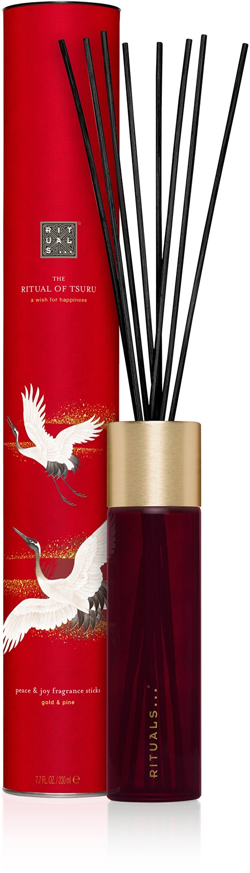 En aromdiffusor i en mörkröd flaska med svarta pinnar, presenterad med en röd ask med vita kråkor och gulddetaljer.