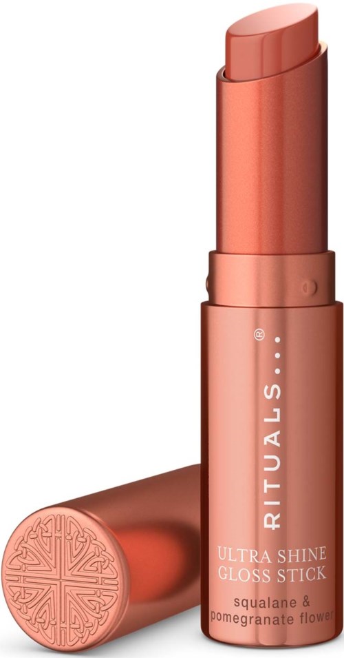 Et korallfarget leppestift med merkevaren RITUALS og teksten ULTRA SHINE GLOSS STICK på tuben.