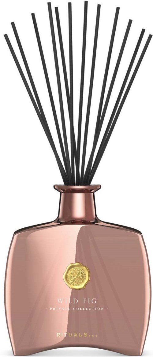 Butelka perfum z różowo-złotym wykończeniem, czarnymi prętami i złotym emblemem, oznaczona zapachem Wild Fig.