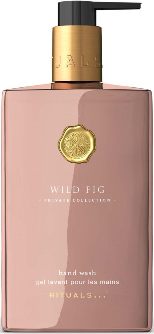 Różowa butelka do mycia rąk z czarną pompą, złotą etykietą i złotym emblem, część kolekcji Wild Fig.