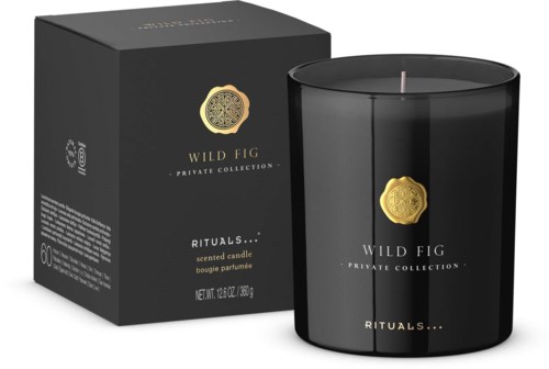 Svart duftlys i krukke med gullmerke og eske merket 'Wild Fig, Rituals, Private Collection.'