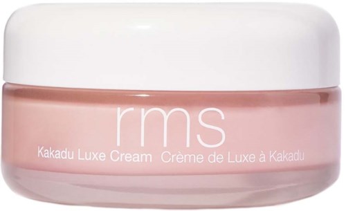 A pink jar of rms Kakadu Luxe Cream with a white lid, labeled in white text.