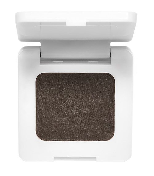 A makeup compact with dark brown powder inside and a white plastic casing.
