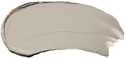 A smudge of cream-colored makeup with smooth, curved edges and a textured side. It looks like cosmetic product.