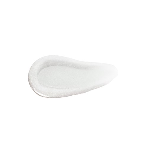 Een hoopje witte crème of zalf in de vorm van een traan.