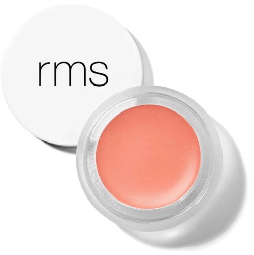 Een ronde container met roze crème binnen en een witte deksel met "rms" geschreven.