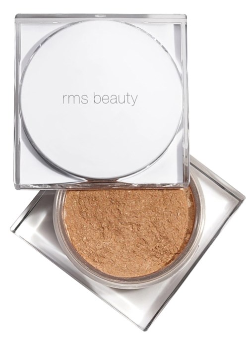 En kvadratisk gjennomsiktig beholder med hvitt lokk som sier "rms beauty". Inne i finner du et gyllenbrunt presset puder.