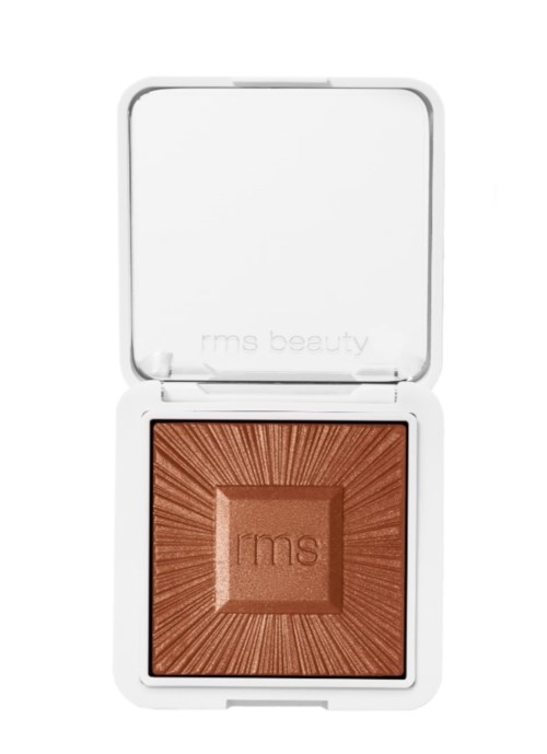 A compact makeup blush with a square bronze-colored product inside a white case.