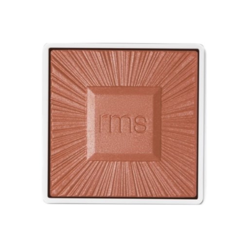 A square blush compact with a textured, radiant design and the letters "rms" in the center.