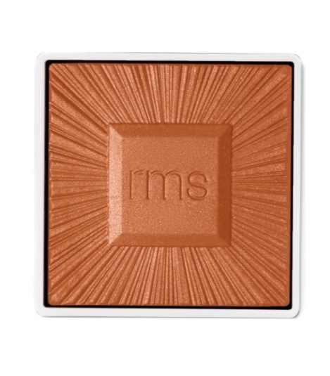 A square makeup blush with a textured surface and "rms" engraved in the center.