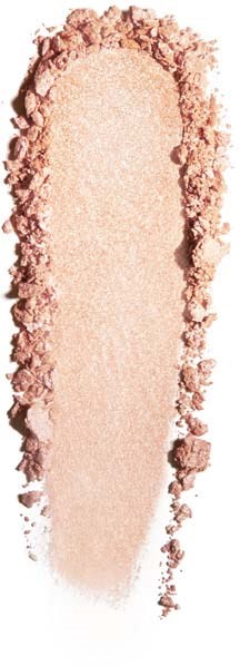 A beige powder is shaped in a tall, elongated oval, with crushed powder borders on a black background.