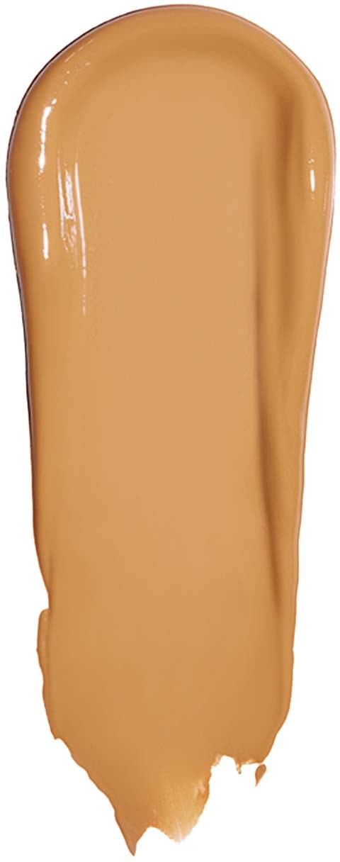 Lange, gebogene Linie aus beige flüssigem Make-up oder Foundation mit glänzender, glatter Oberfläche.