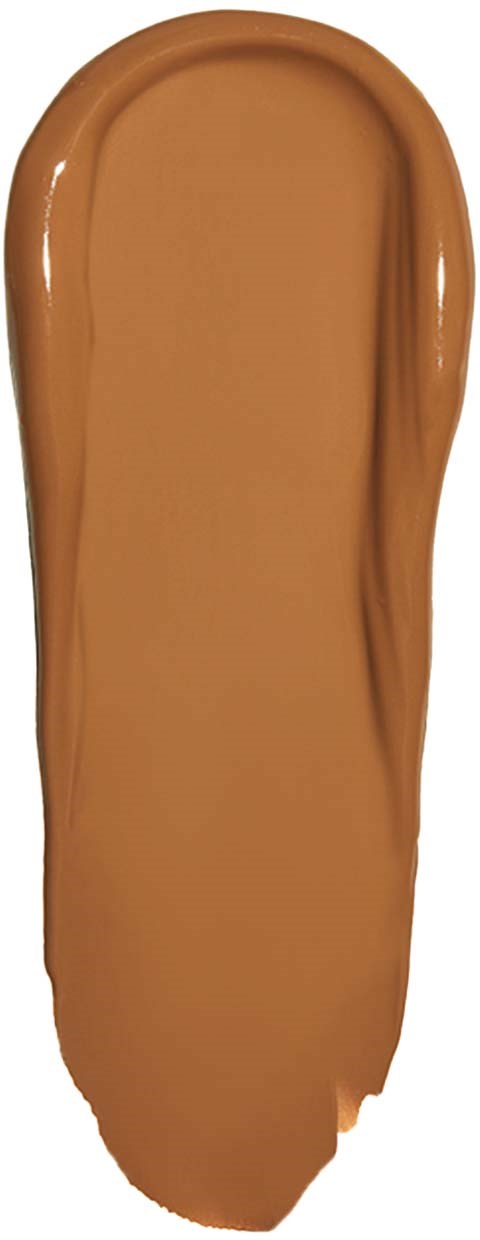 A smear of light brown cosmetic foundation on a white background.