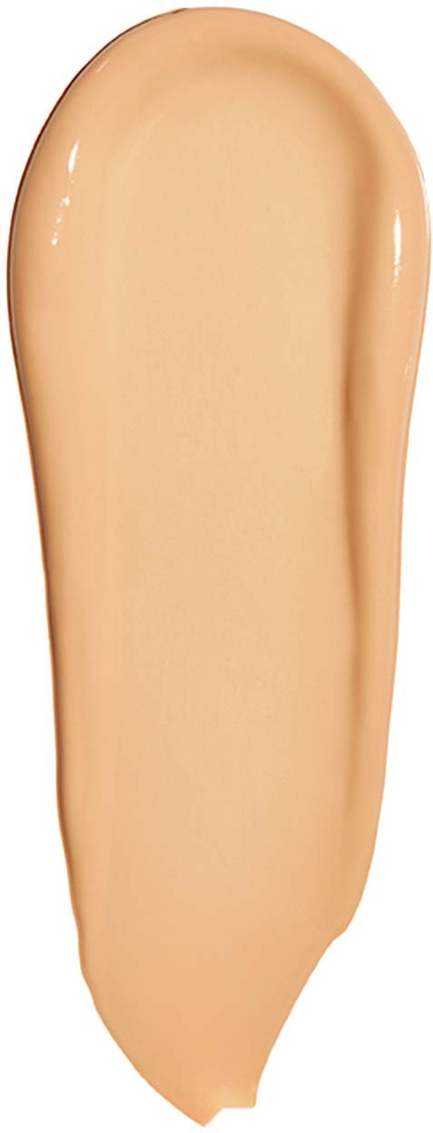Ett beige färgat flytande foundationprov, slätt och krämigt, med en glänsande yta, på en vit bakgrund.