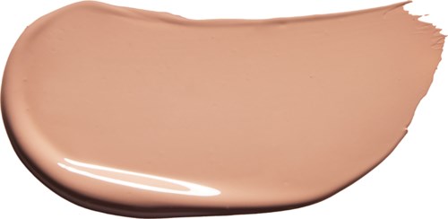 A smear of beige foundation makeup with a shiny, creamy texture and a brush stroke shape.