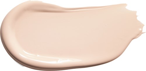A smooth, light beige cream or lotion spread on black background.