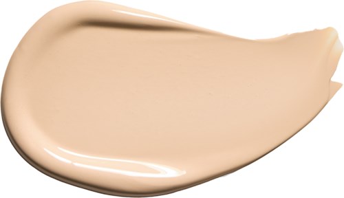 A beige liquid cream in a spoon shape, smooth and shiny. Likely foundation or makeup product.