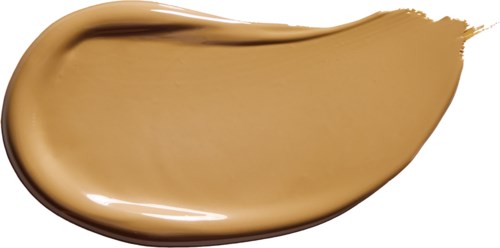 A swatch of beige or foundation makeup with a smooth, creamy texture and a slight shine.