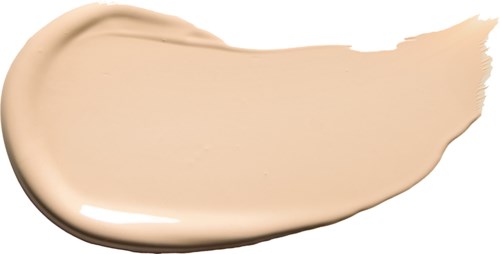 A beige-colored liquid spread in a curved shape on a white background.
