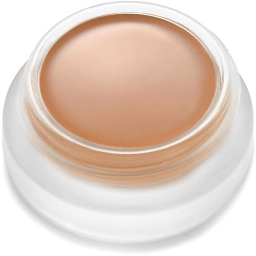 A round container with beige cosmetic cream inside, top view showing smooth surface and clear opening.