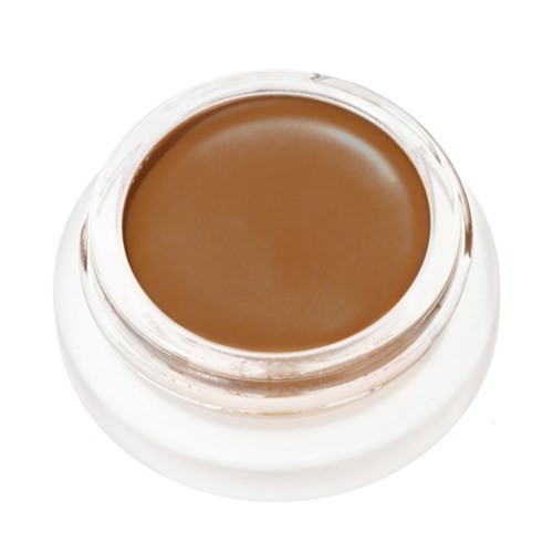 A small jar of brown cream or makeup, with a round shape and clear lid.