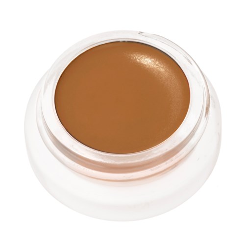 Liten krukke med brun makeup eller krem på toppen, sett ovenfra med hvitt lokk.