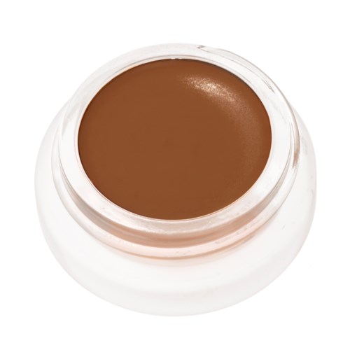 A small jar of brown cream or makeup, viewed from above with a white lid.